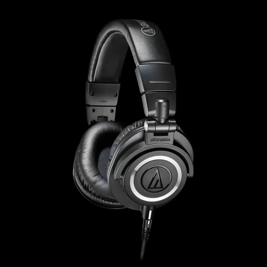 Black Audio-Technica ATH-M50x headphones in a three-quarter side view